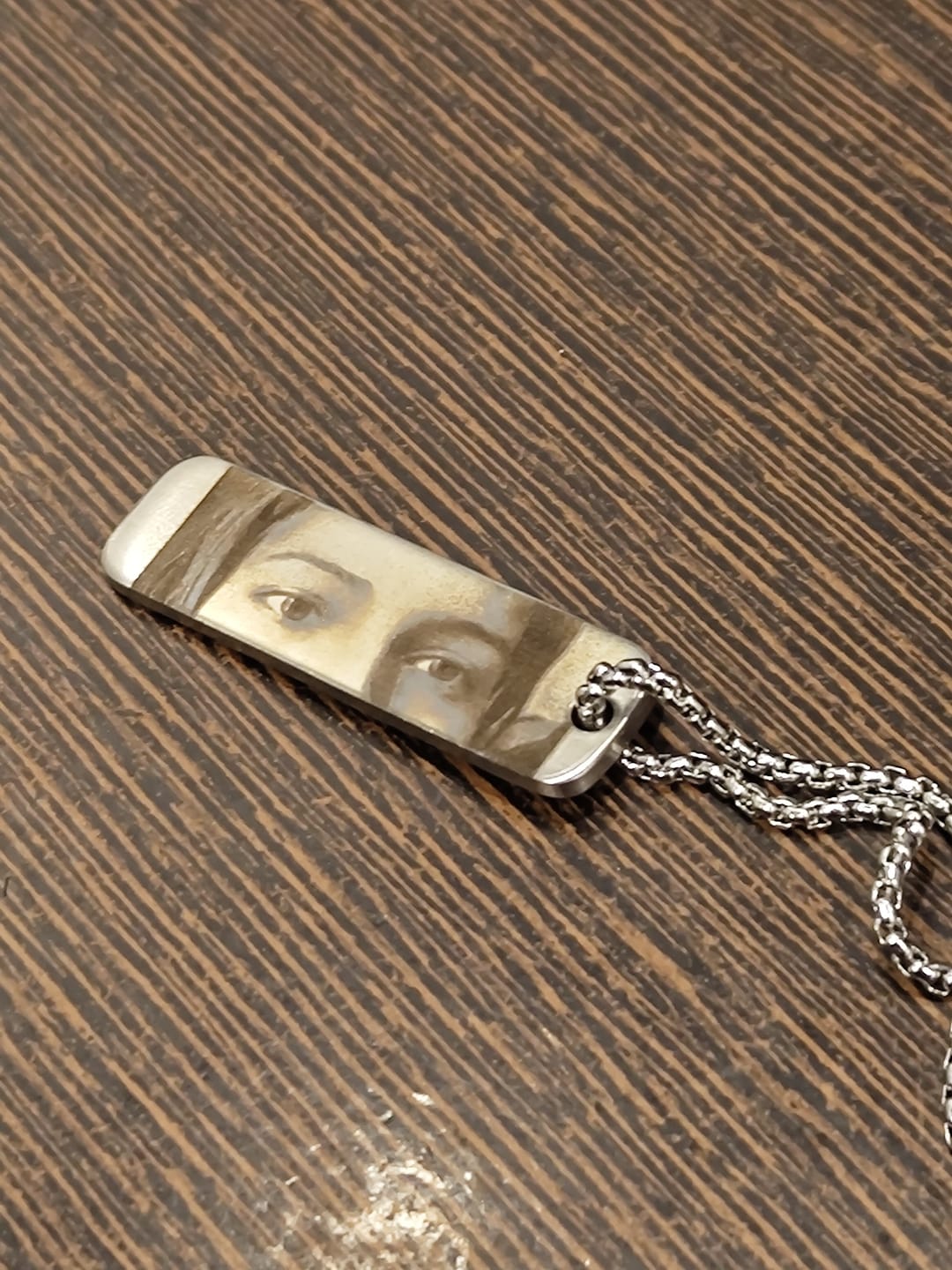 Customer photo review of Eyes Engraved Photo Pendant