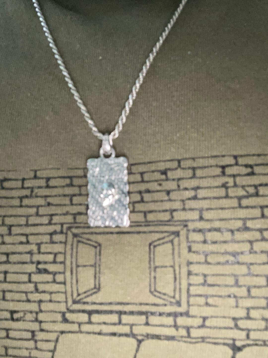 Customer photo review of LAUGH NOW, DIE LATER PENDANT
