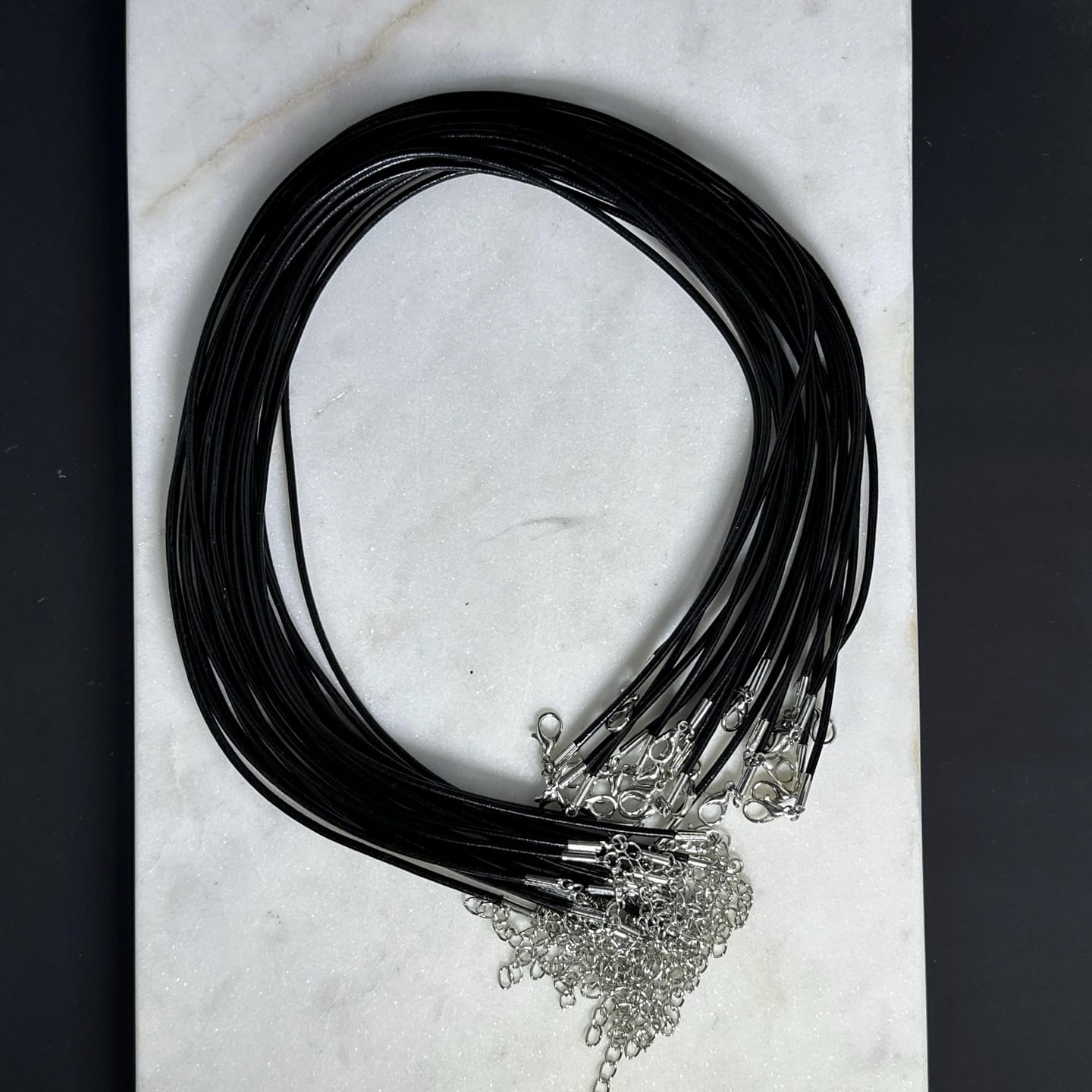 Customer photo review of Genuine Leather Necklace Cord, Wholesale 18 Inch Black Leather Cord Necklace with Extender Chain for Women & Men
