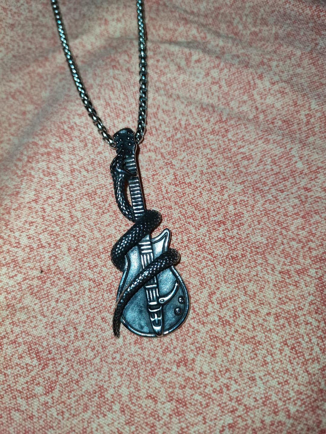 Customer photo review of THE SERPENT GUITAR. - NECKLACE
