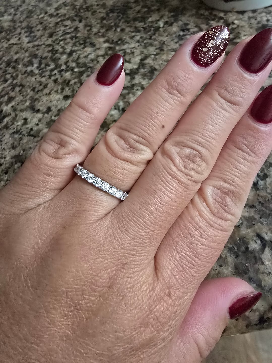 Customer photo review of Pave Moissanite Eternity Wedding Band Ring In Sterling Silver