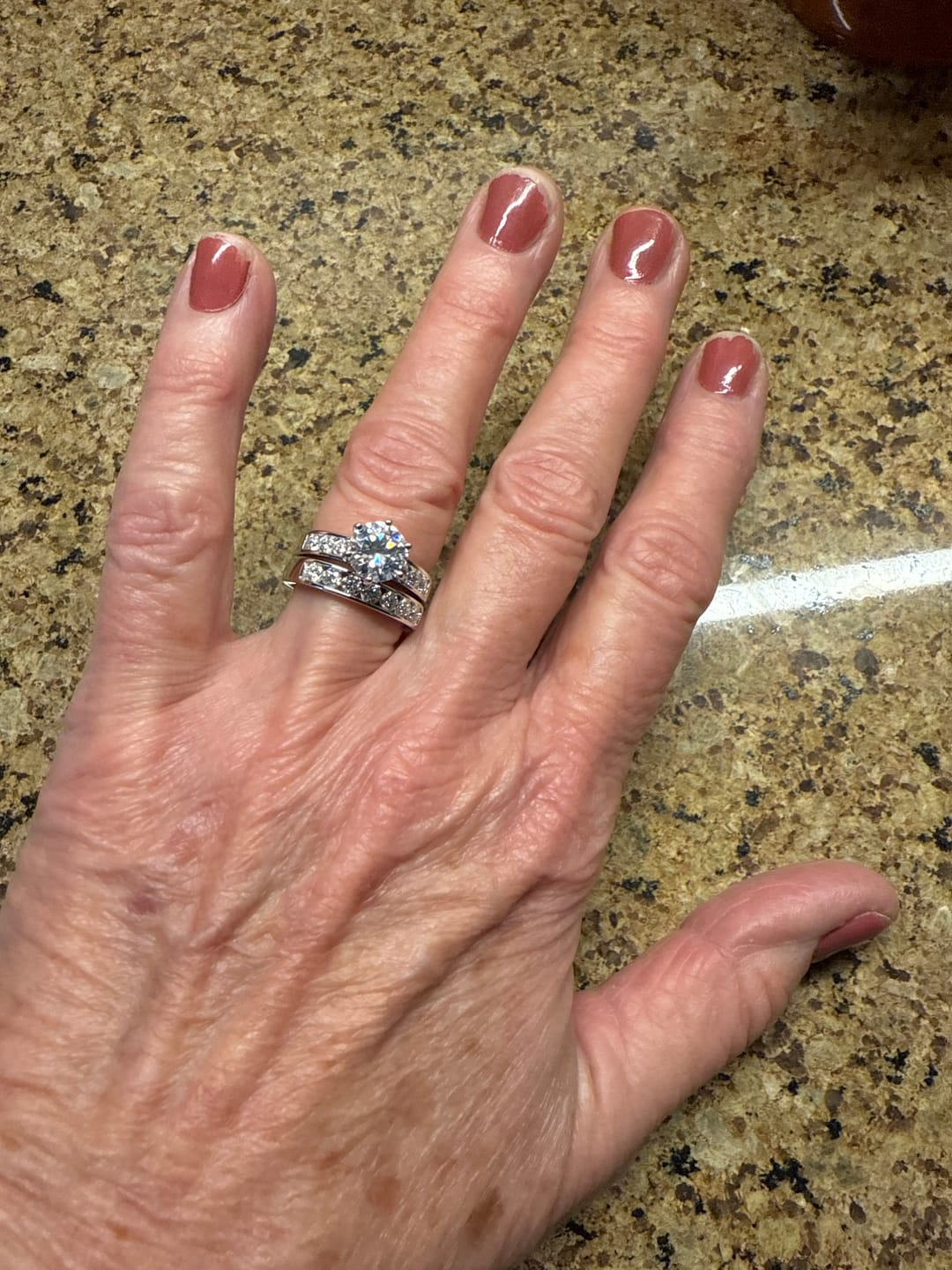 Customer photo review of Channel Set Moissanite Half Eternity Wedding Band Ring In Sterling Silver