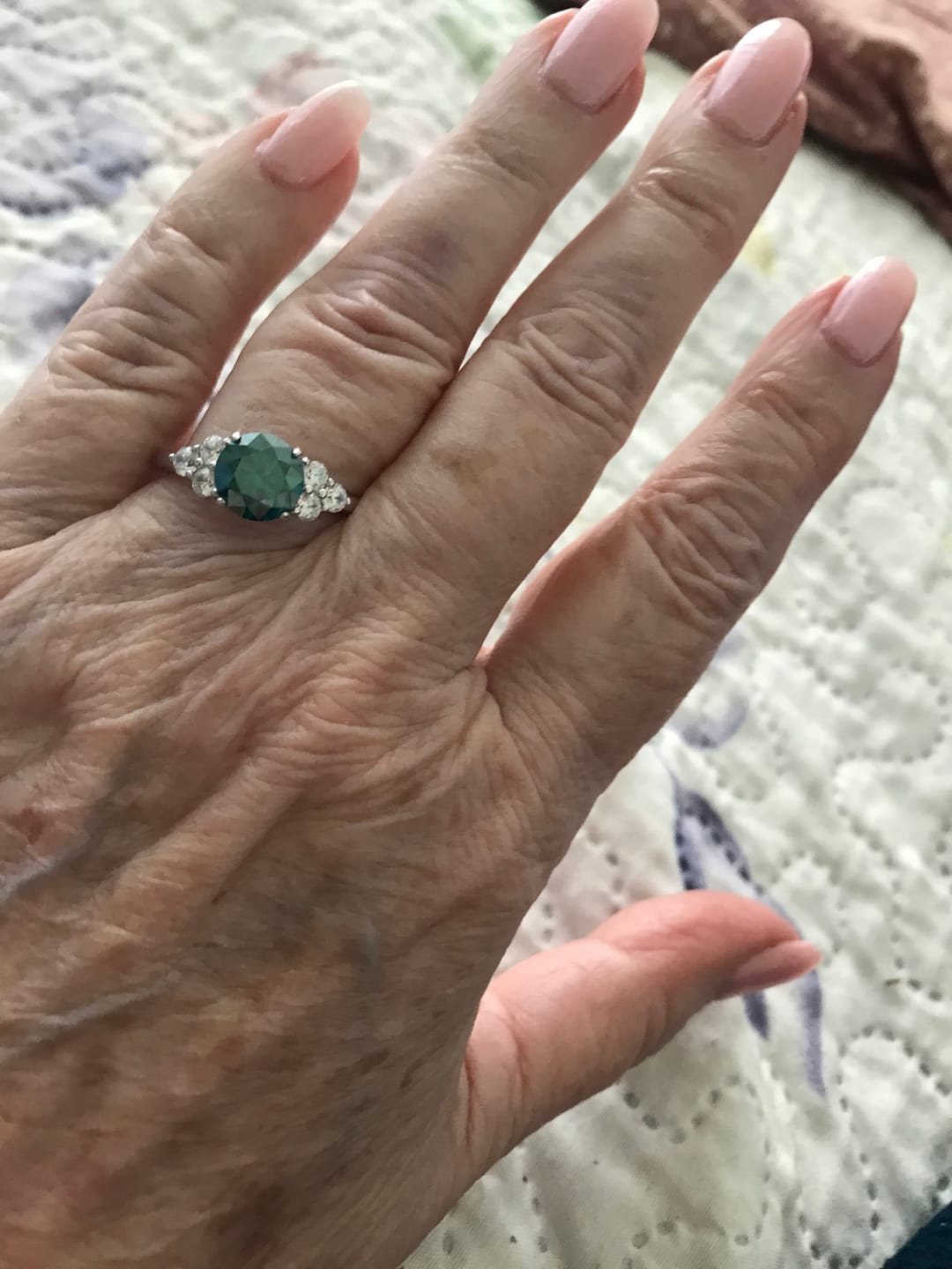 Customer photo review of Green Moissanite Side Stone Engagement Ring