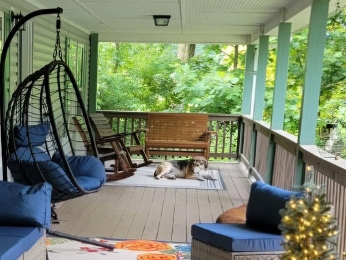 Customer photo review of Wooden Patio Glider Bench with Cup Holders Heavy Duty 900lbs, Outdoor Loveseat Glider with Ergonomic Deep Contoured Seat