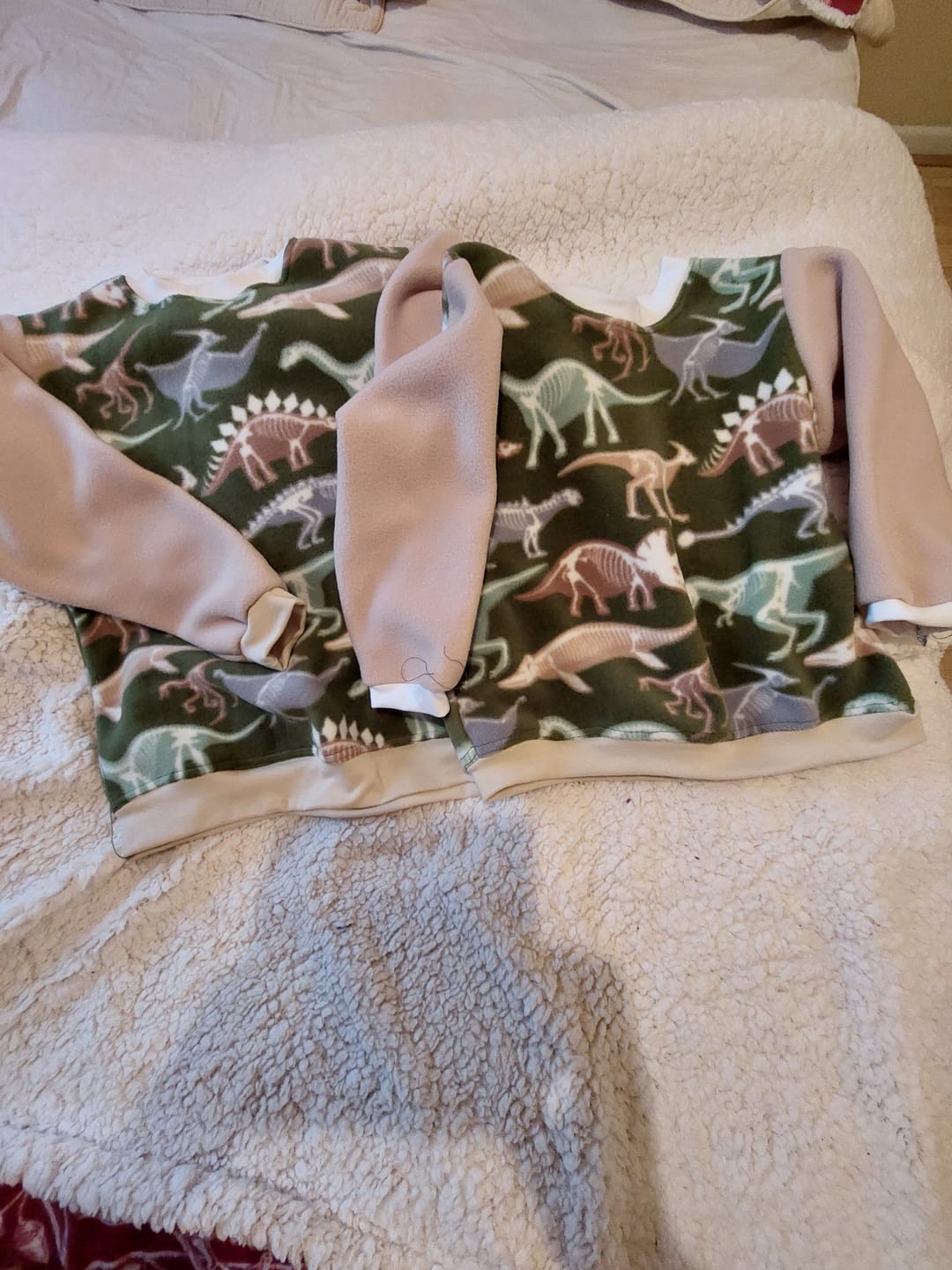 Customer photo review of Dino Skeletons on Green Anti Pill Polar Fleece Fabric