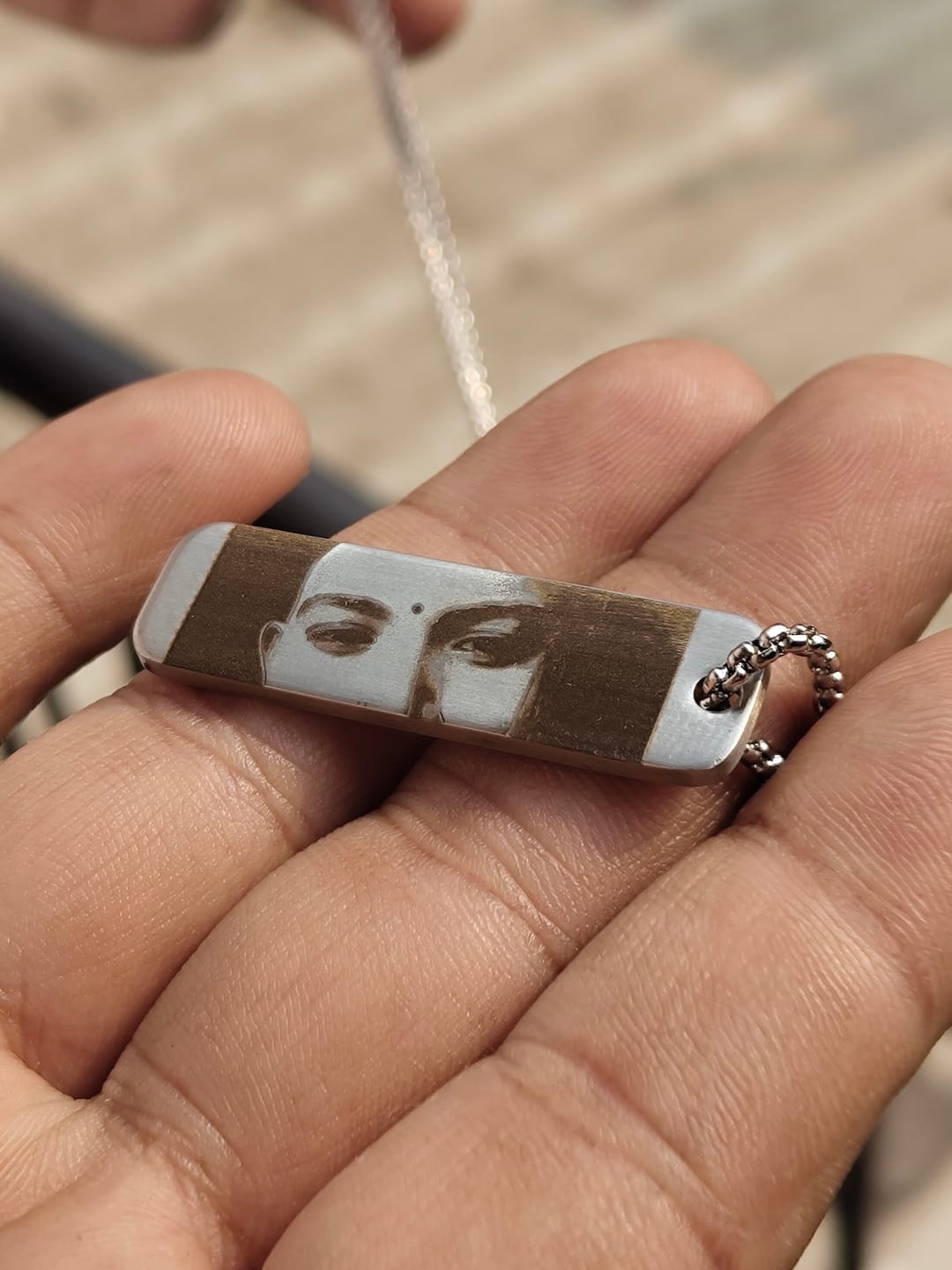 Customer photo review of Eyes Engraved Photo Pendant