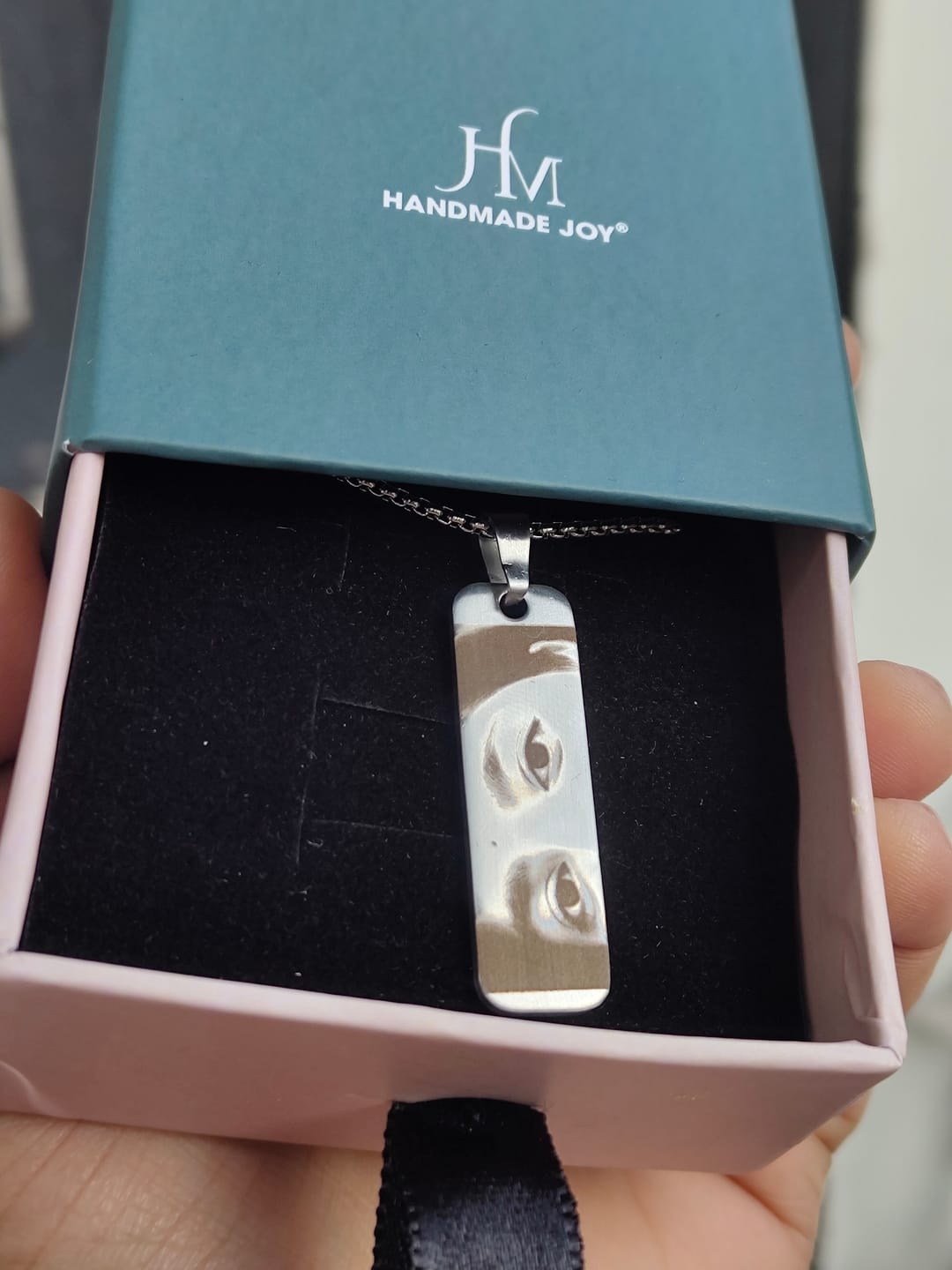 Customer photo review of Eyes Engraved Photo Pendant