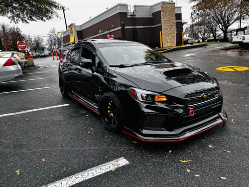 Customer photo review of Fit 2015-2021 Subaru WRX STI SEDAN Front Splitter & Side Skirts (Black & Red Trim)