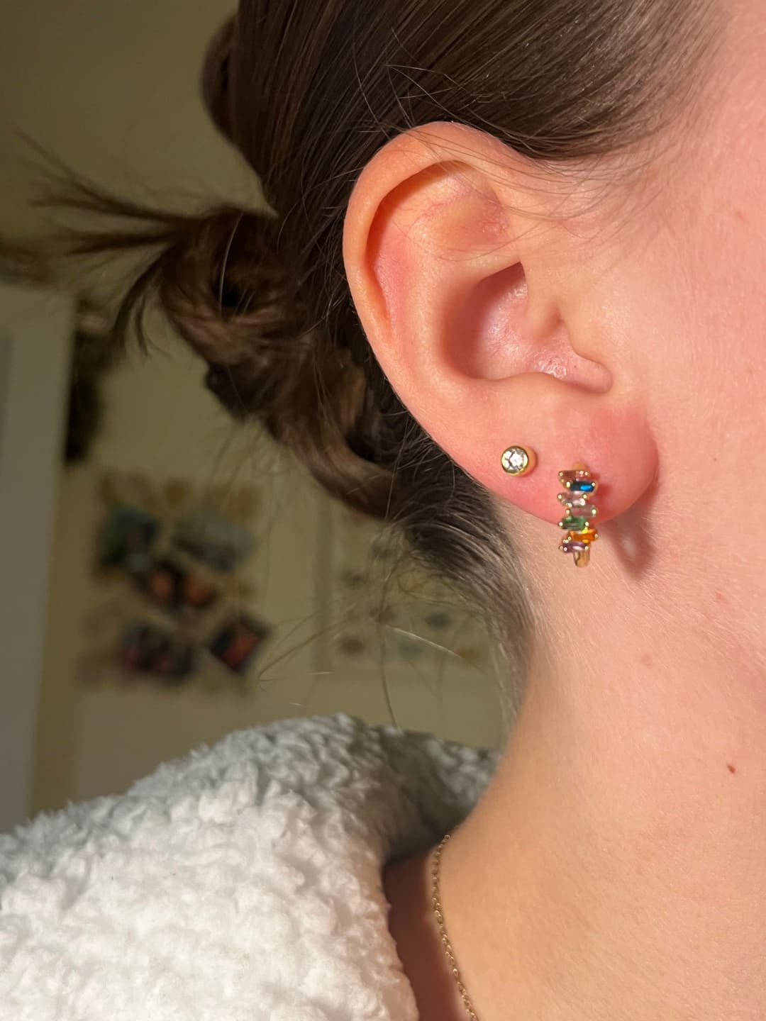 Customer photo review of Lola Gold Rainbow Huggie Earrings