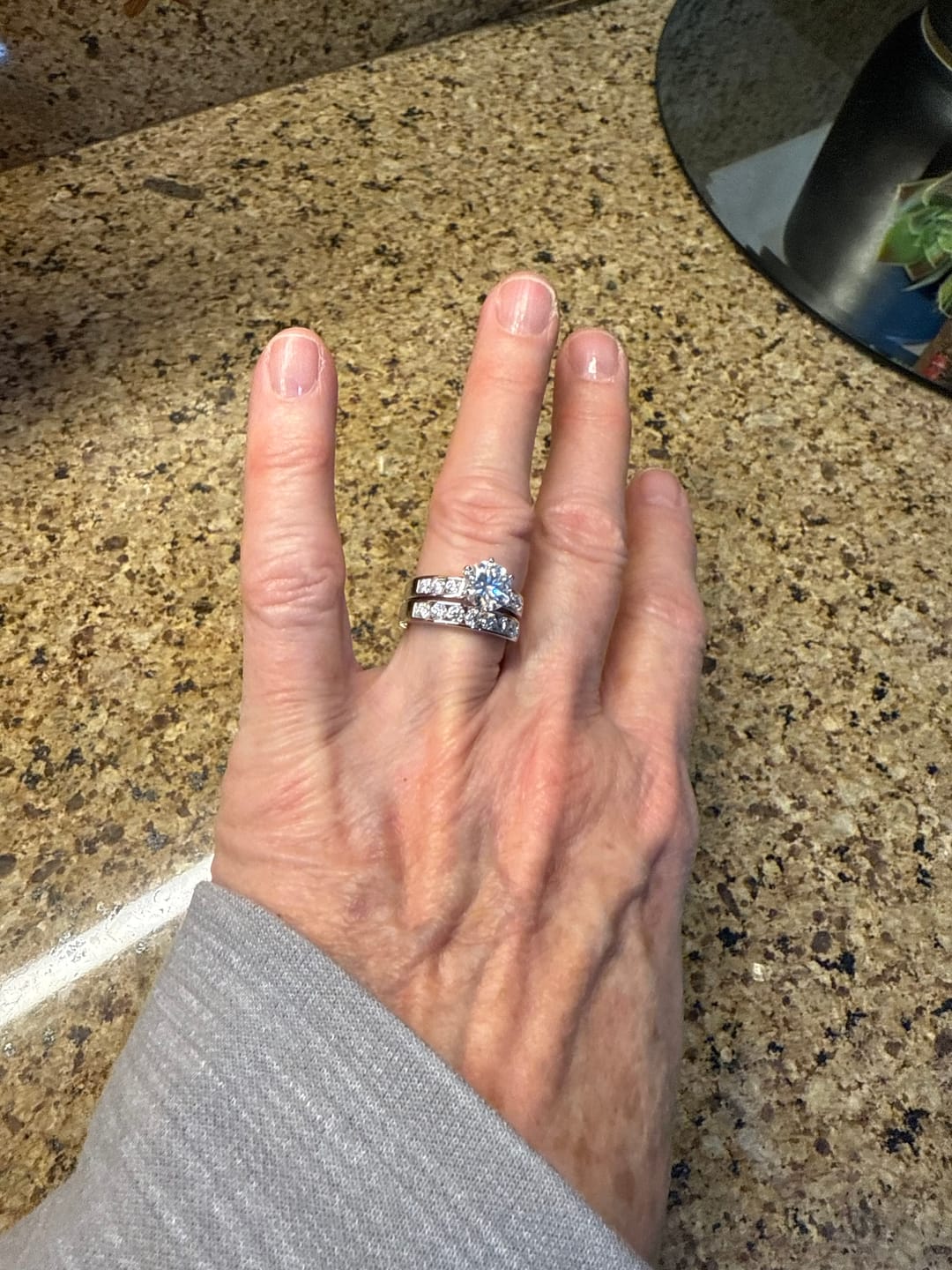 Customer photo review of Channel Set Moissanite Half Eternity Wedding Band Ring In Sterling Silver