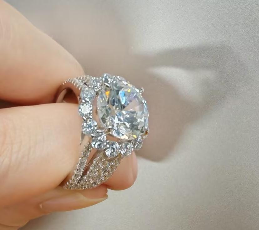Customer photo review of Louily Unique Halo Design Round Cut Engagement Ring In Sterling Silver