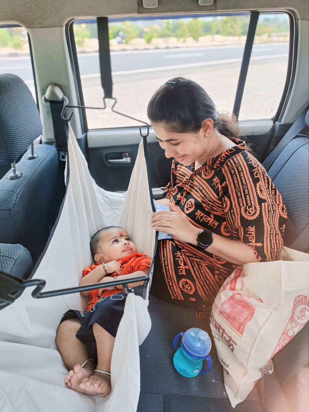 Customer photo review of CarNap - Portable Car Hammock for 0 to 3 year baby | with Adjustable Belt, Hammock Cloth, Hangers and Carry Bag | use at Car, Train, Home