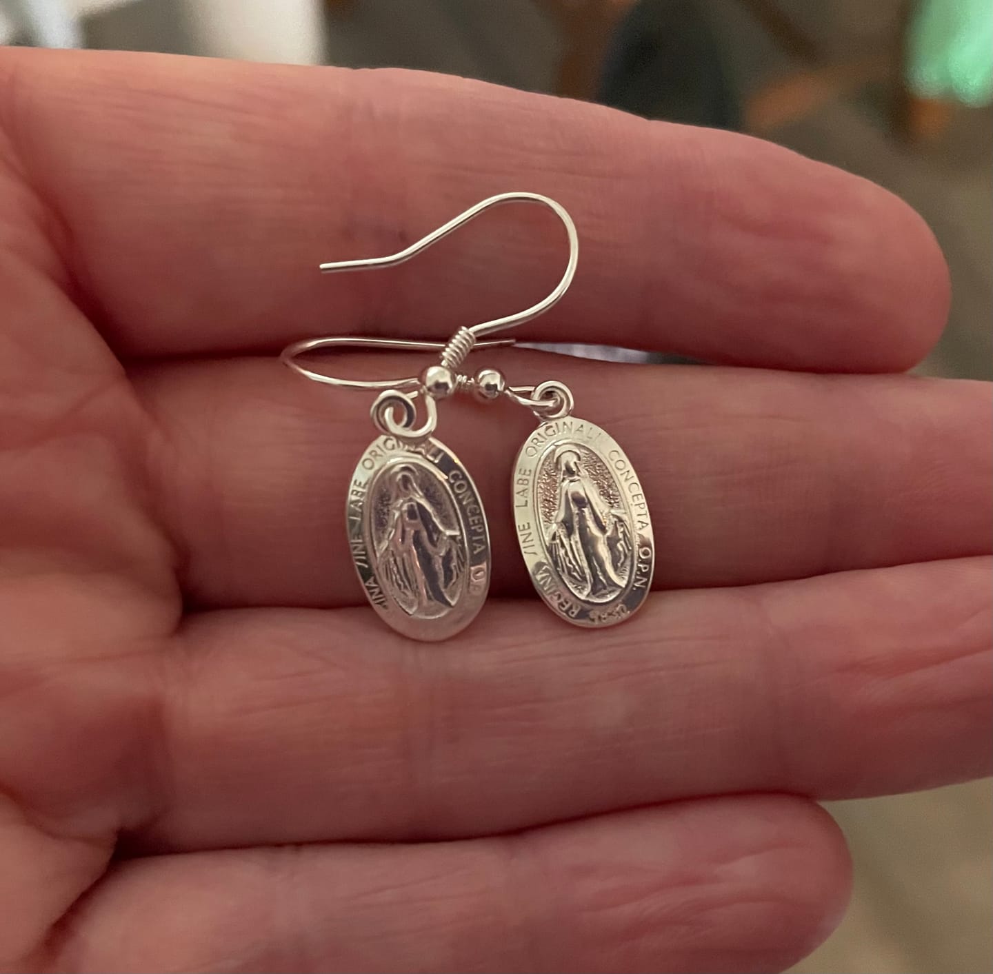 Customer photo review of Miraculous Medal Earrings // Silver