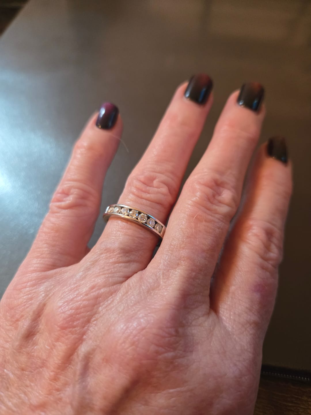 Customer photo review of Channel Set Moissanite Half Eternity Wedding Band Ring In Sterling Silver