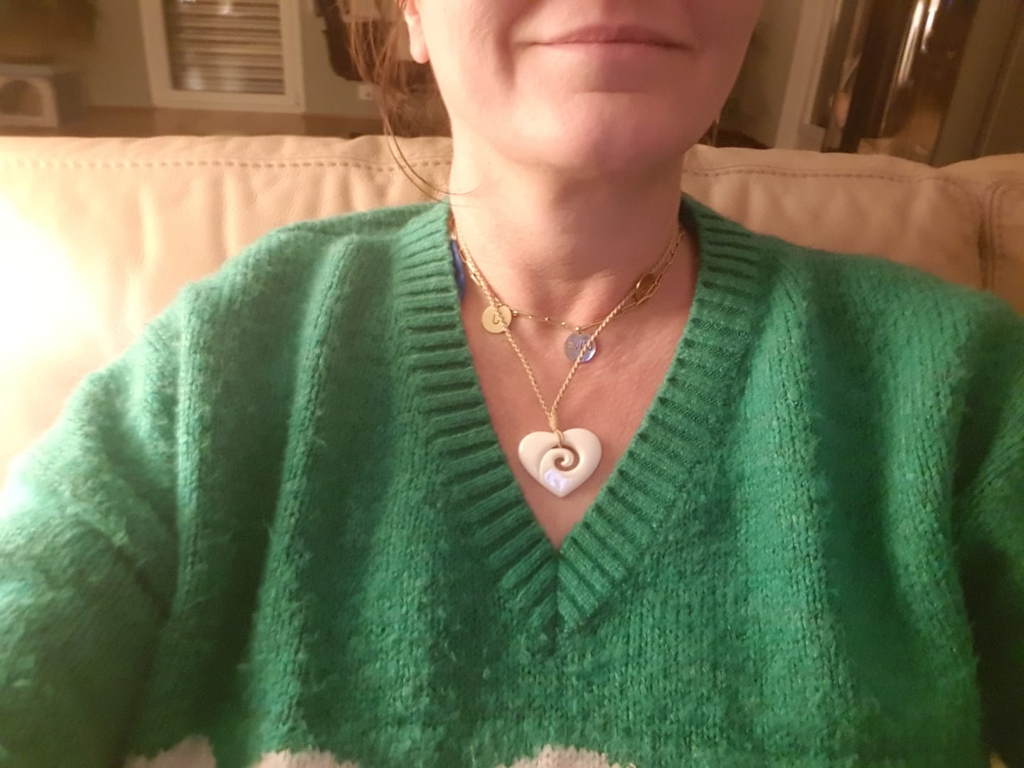 Customer photo review of Maori Bone Koru Heart Necklace