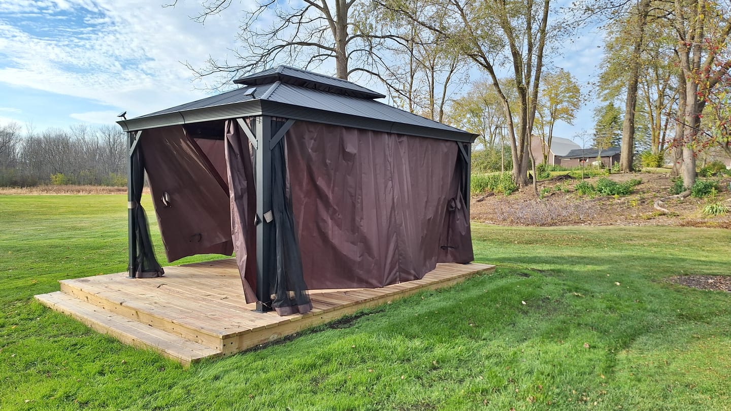 Customer photo review of Shade N' Shelters 10' x 14' Granite Peak Hardtop Gazebo Privacy Curtain with Hooks