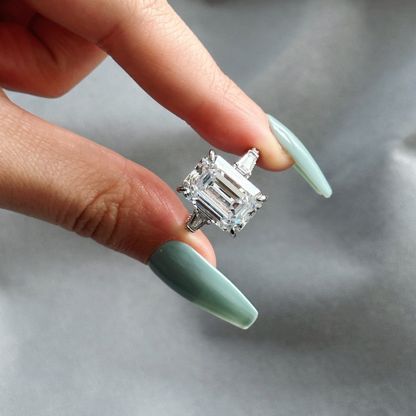 Customer photo review of Louily Unique Emerald Cut Three Stone Engagement Ring In Sterling Silver