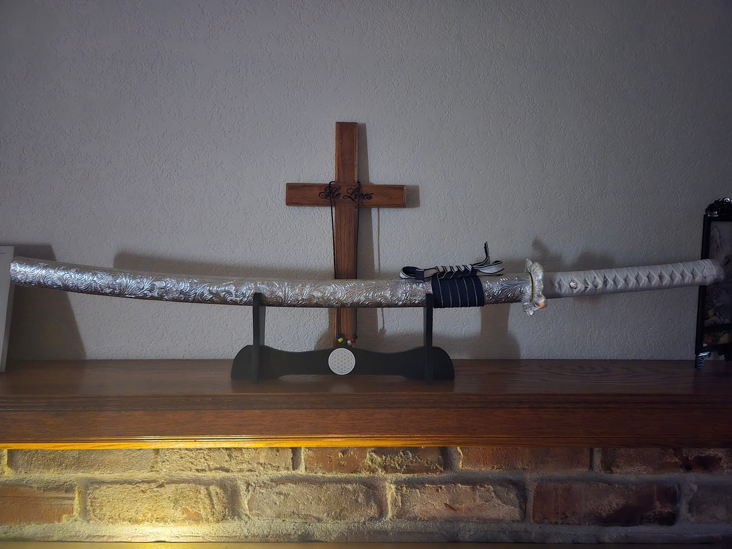 Customer photo: a katana on a stand in a living room