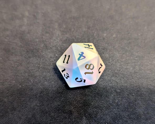 Customer photo review of Gemstone (Inked) Raised Dichroic Glass DND Dice Set