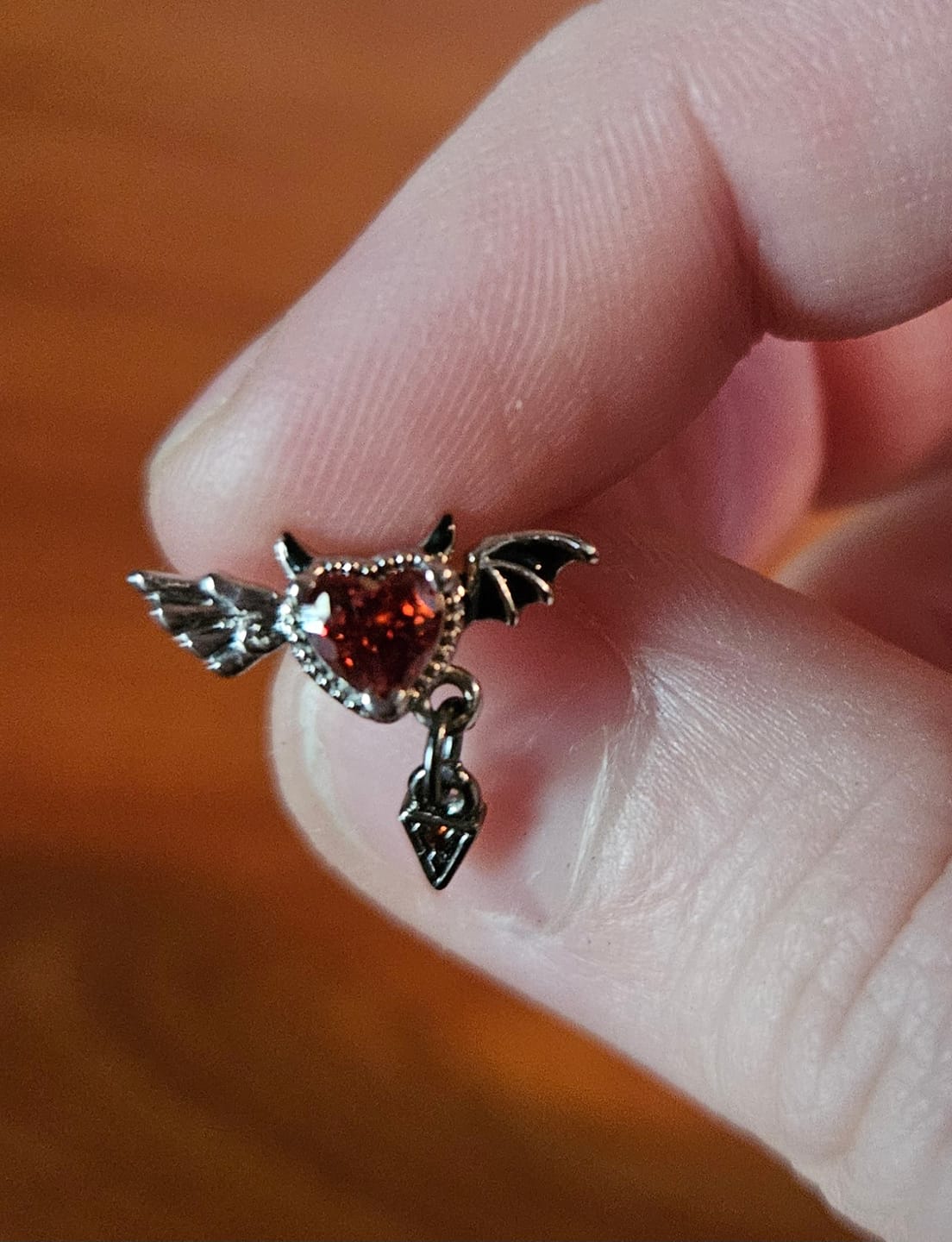 Customer photo review of 20G Devil Wings Nose Studs Piercing L Shape Nose Rings Red Zirconia Nostril Piercing