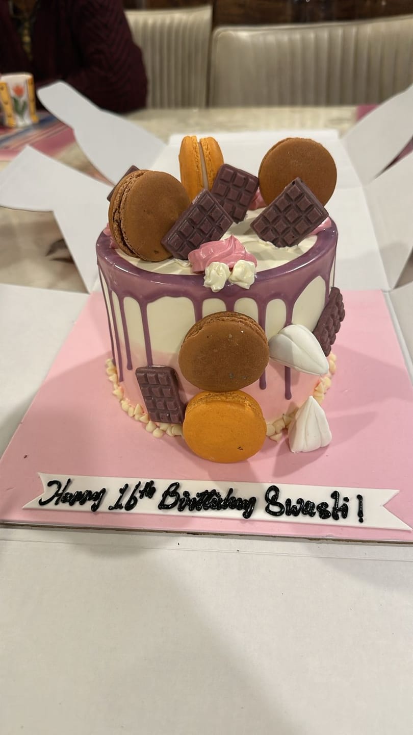 Customer photo review of Purple Drip Macaron Cake