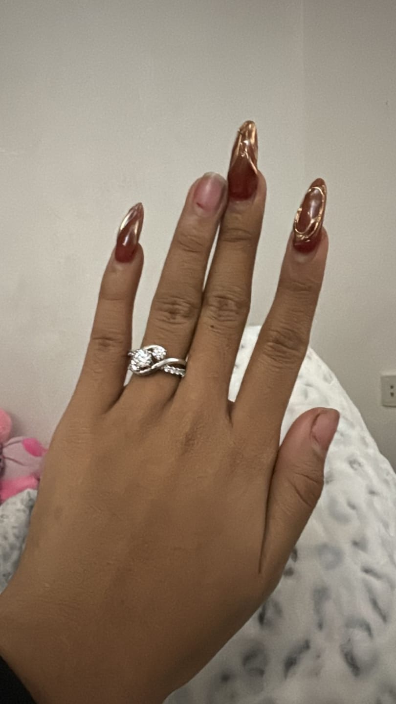 Customer photo review of Swirl Three Stone Moissanite Twisted Pave Engagement Ring