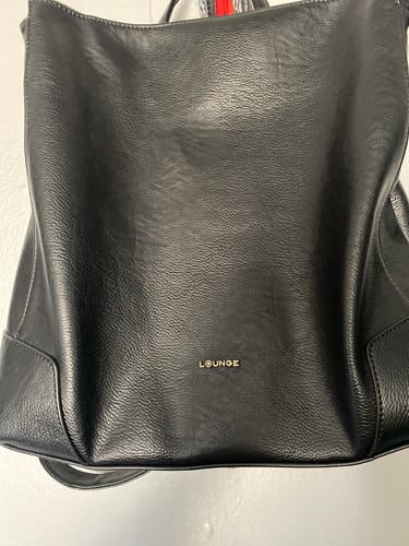 Reseña con foto de un cliente sobre Mochila Costuras