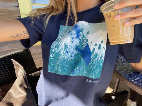 Customer photo review of wall street baby tee