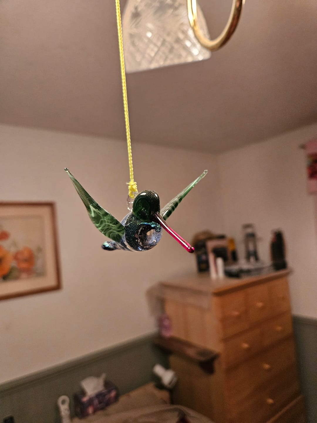 Customer photo review of Dichroic Twist Glass Hummingbird with Infused Ash