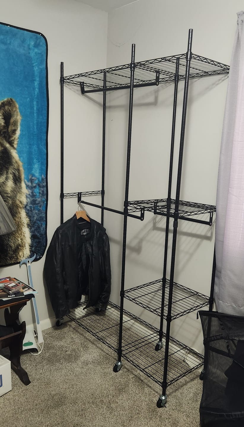 Customer photo review of Raybee Heavy Duty Portable Clothes Rack With Wheels,Clothing Rack For Hanging,Garment Rack For Bedroom