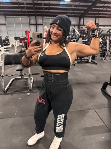 Customer photo review of Salty Savage Ladies “Spliced Smile” Back Day Halter Sports Bra | Black/White