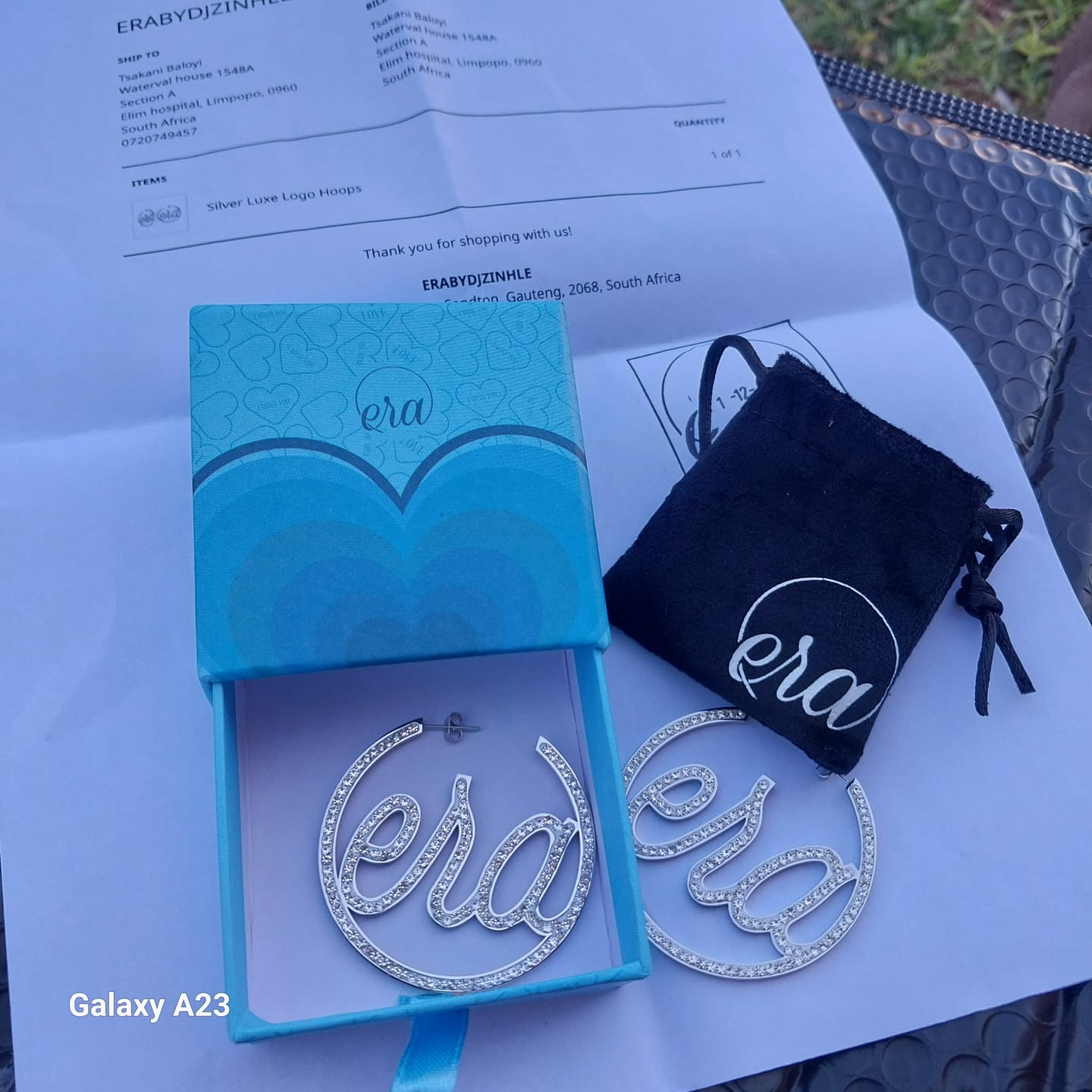Customer photo review of Silver Luxe Logo Hoops