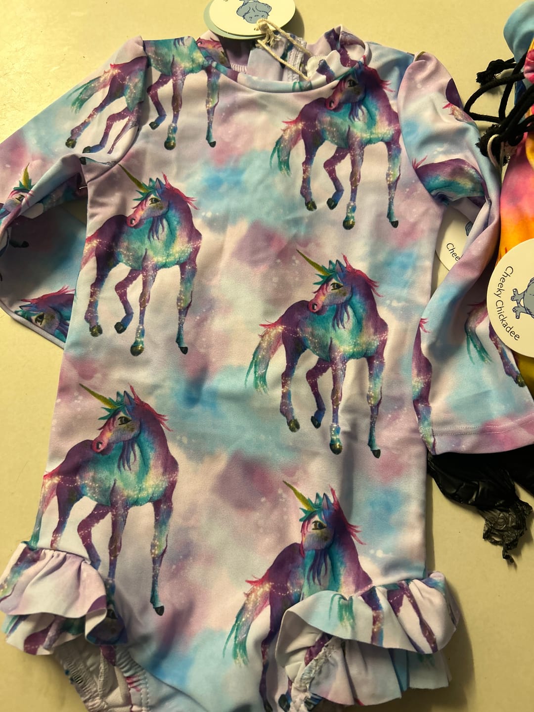 Customer photo review of Magical Unicorn Girls Long Sleeve Back Zip Swimmers