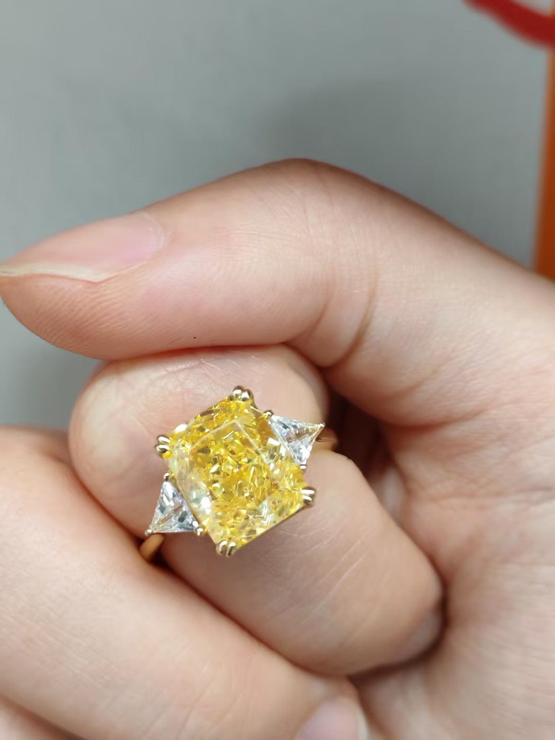 Customer photo review of S925 4.0Ct Radiant & Triangle Cut Yellow Stone Three Stone Engagement Ring In Sterling Silver