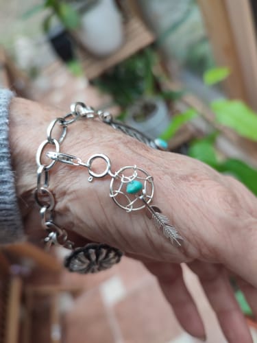 Customer photo review of Navajo Crafted Sterling Silver Turquoise Dream Catcher  Charm