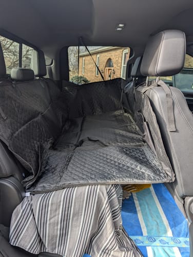 Customer photo review of NEW Waterproof Hard Bottom Car & Truck Seat Foldable Hammock Cover With Storage Pockets, Side Flaps, Headrest Straps, Seat Anchors, & Mesh Window (+FREE SAFETY BELT!)