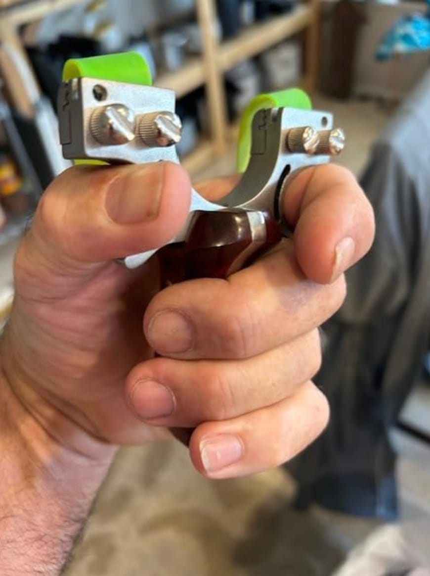 Customer photo review of Stainless Steel Wooden Handle Laser Hunting Slingshot II: Precision Redefined