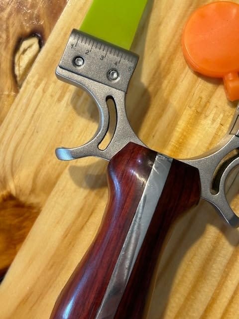 Customer photo review of Stainless Steel Wooden Handle Laser Hunting Slingshot II: Precision Redefined