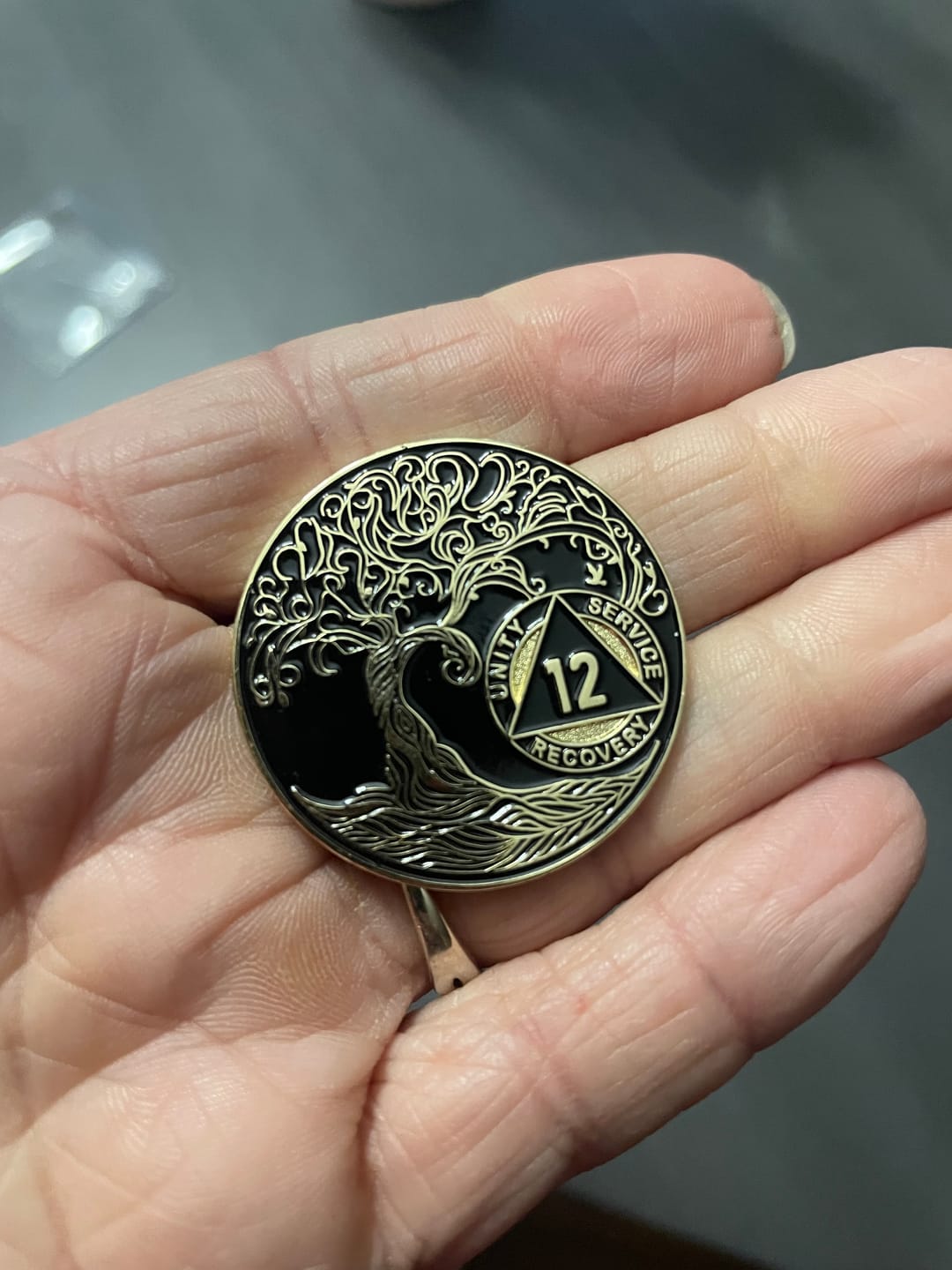 Customer photo review of 12 Year Sobriety Mint Twisted Tree of Life Gold Plated AA Recovery Medallion - Twelve Year Chip/Coin - Black