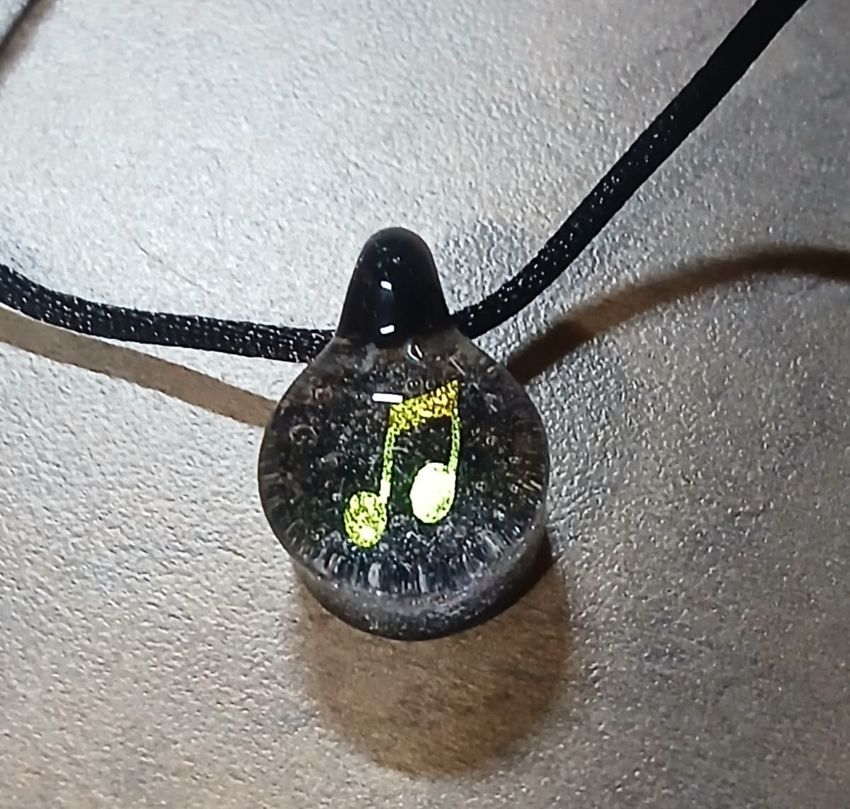 Customer photo review of Music Note Hologram Pendant with Infused Cremation Ash