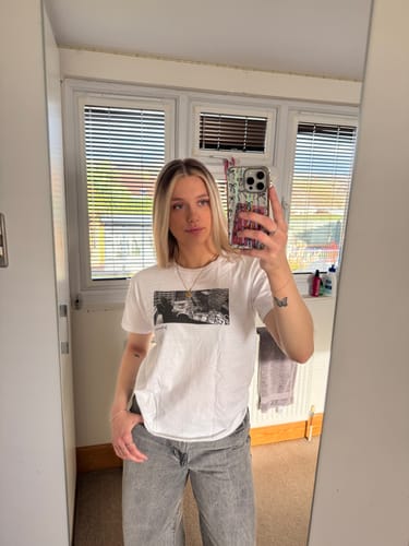 Customer photo review of wall street baby tee