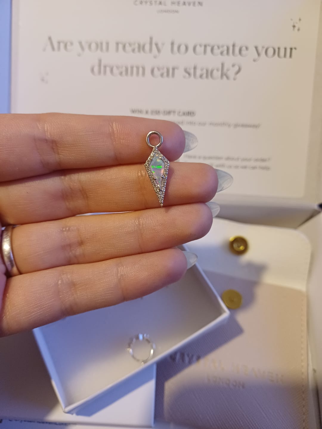 Customer photo review of AURA Mini Opal Pavé Kite Charm
