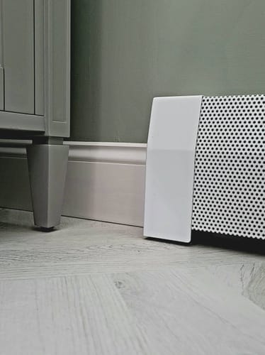 Customer photo review of Tall White Baseboard Covers by the Foot