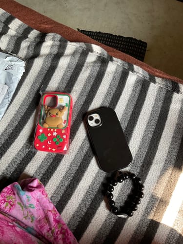 Customer photo review of Oval Shape Silicon Case With Hand Bracelet for iPhone ( Black )