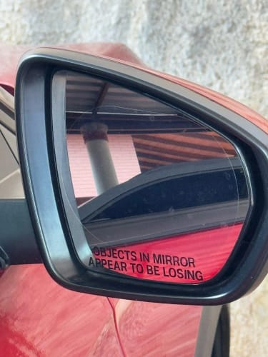 Customer photo review of Objects in Mirror Appear to be Losing Car Sticker