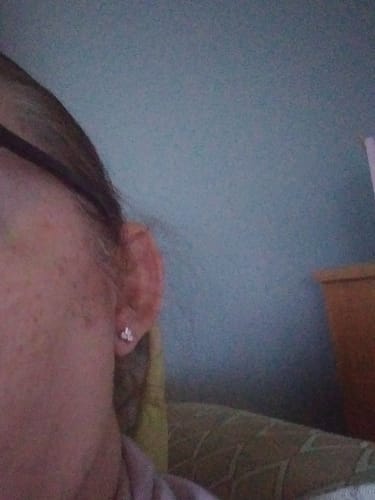 Customer photo review of Trinity Moissanite Sleep Stud Earrings