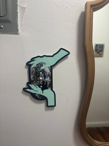 Customer photo review of Melting Candle Light Switch Cover