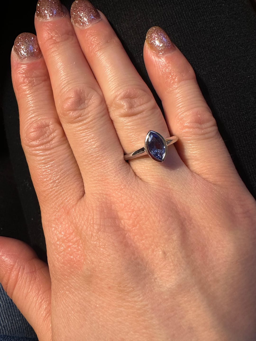 Customer photo review of Surf Moon Ring with Tanzanite