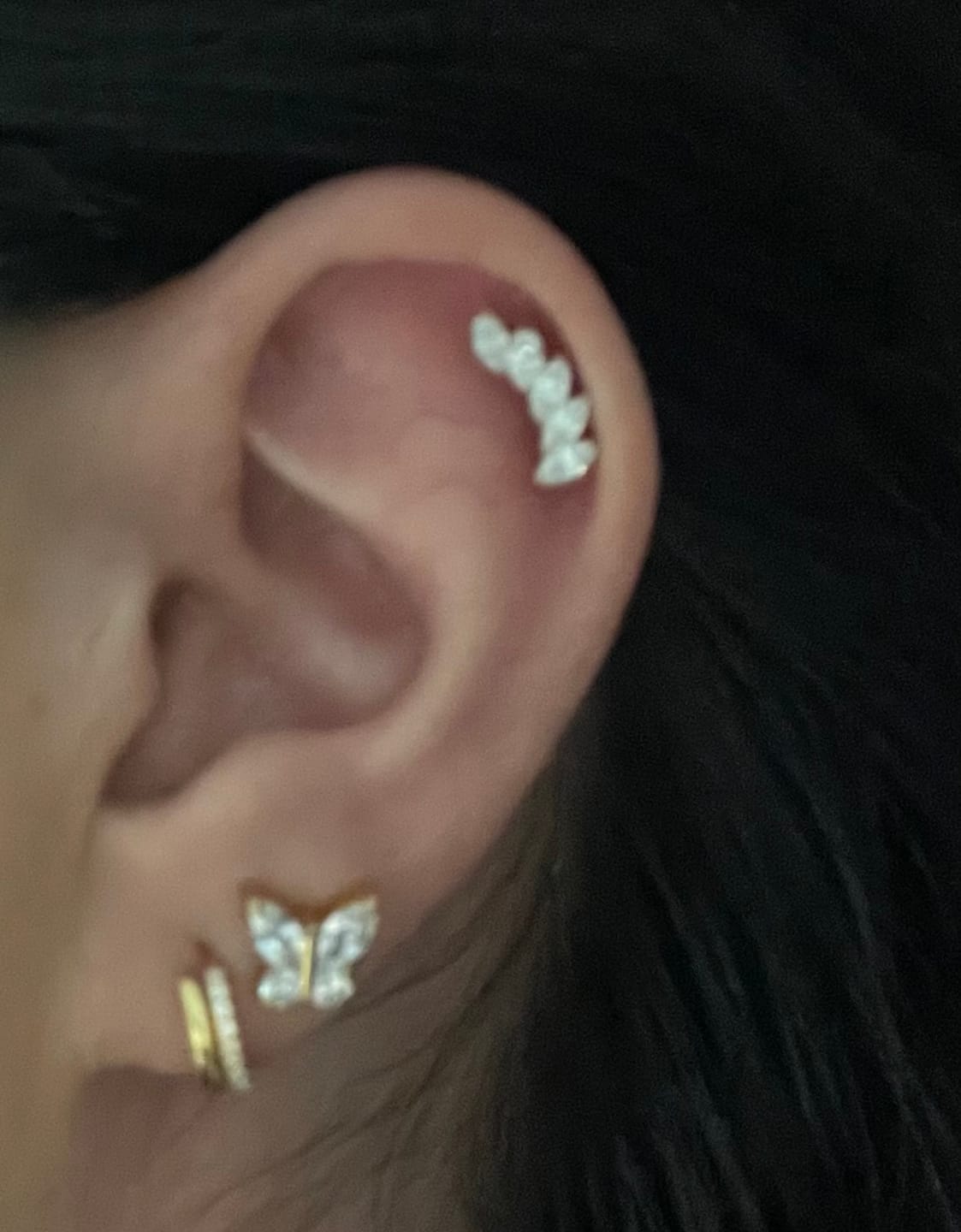 Customer photo review of Feather Piercing | Titan