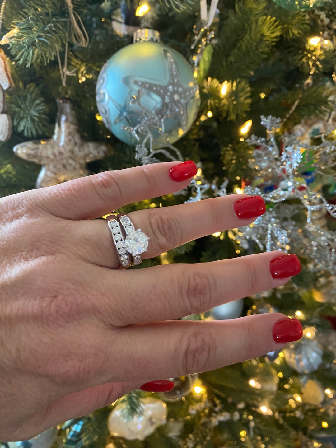 Customer photo review of Channel Set Moissanite Half Eternity Wedding Band Ring In Sterling Silver